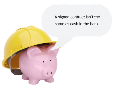 A pink piggy bank wearing a hard hat with a speech bubble that says 'A signed contract isn't the same as cash in the bank'.